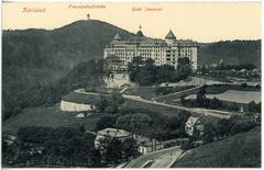 Historic black and white photo of Hotel Imperial in Karlsbad with vintage architecture and surrounding trees in 1914