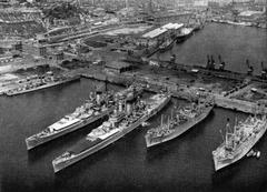 U.S. Navy Sixth Fleet ships docked in Barcelona harbor in 1956 including USS Cassin Young, USS Albany, USS Newport News, USS Mercury, and USS Mauna Loa
