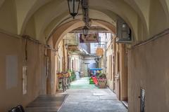 Courtyard of a historic building on Main Street in Kosice with outdoor seating and flowers