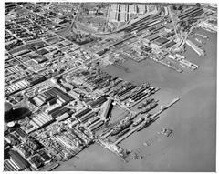 Aerial view of Bethlehem Union Iron Works shipyard in 1945 with ships under construction and industrial facilities