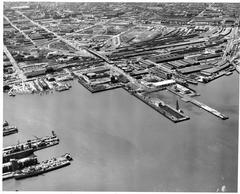 Aerial view of Bethlehem Union Iron Works shipyard in 1943 with multiple ships under construction and repair