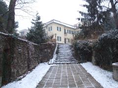 Entrance of Bajor Gizi Actors' Museum with a classic architectural facade and statues