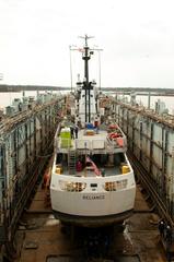 Coast Guard Cutter Reliance docked in USS Oak Ridge floating dry dock at Coast Guard Yard Baltimore for maintenance