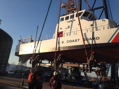 Coast Guard Yard crane hoisting the 87-foot Coast Guard patrol boat Bluefin in Baltimore