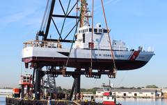 Coast Guard Yard crane hoisting the 87-foot Coast Guard Cutter Coho during undocking in Baltimore