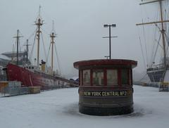 Deckhouse on pier with Ambrose lightship and sailing ship Peking in New York