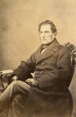 Portrait of Valentín Alsina, 4th president of Argentina, seated and dressed elegantly with gloves