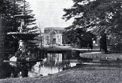 Victorian Peacock Fountain and lily pond at Botanic Gardens in Christchurch with McDougall Art Gallery in the background