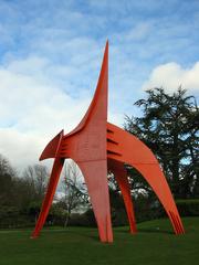 Eagle sculpture by Alexander Calder, 1971, in front of Seattle Asian Art Museum with Volunteer Park Conservatory in background
