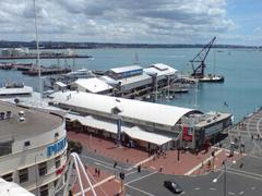 Auckland National Maritime Museum on the wharf with floating crane in downtown Auckland New Zealand