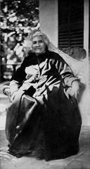 Portrait of Queen Liliuokalani sitting on the lanai of her home in 1917
