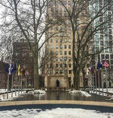 Large stone Tomb of the Unknown Soldier of the American Revolution with a soldier statue covered in snow in winter at Independence National Historical Park, Pennsylvania
