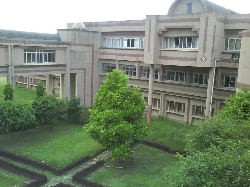 Courtyard of BBAU University with historic architecture and green lawn