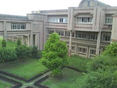Courtyard of BBAU University with historic architecture and green lawn