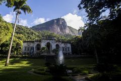 Beautiful historic building in Parque Lage surrounded by lush greenery and trees in Rio de Janeiro