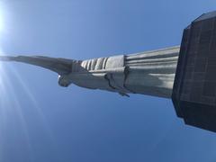 Christ the Redeemer statue close-up view with clear blue sky
