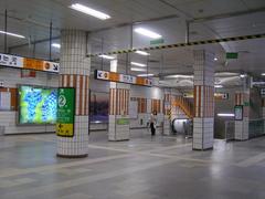 Euljiro 3-ga Station entrance with people and cityscape in Seoul