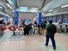 KJ1 Gombak LRT concourse in Selangor with modern architecture and passengers