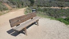 Wooden bench with inscription WRSHP 10 at Will Rogers State Historic Park