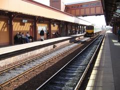 Platforms at Birmingham Moor Street station with trains and overhead structures