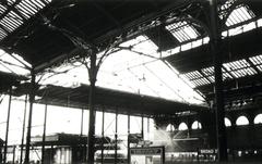 Demolition of Victorian glass and cast iron roof at Broad Street station with Eastern Region train hauled by Brush type 2 class 31