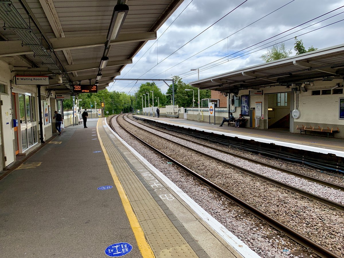 View of Platforms 1 and 2 at Gospel Oak railway station with tracks and overhead lines