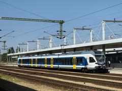 Budapest Kelenföld railway station exterior with trains and commuters