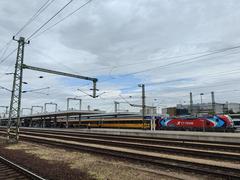 Budapest Kelenföld railway station with tracks and platforms under a cloudy sky