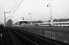 View of the platform at Leiden Lammenschans railway station in Leiden with the station building in the background