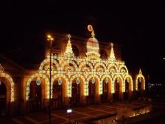 Illuminated Lille-Flandres train station resembling a Hindu palace at night