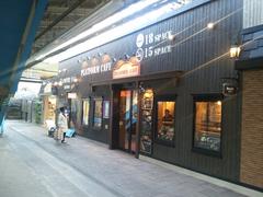 Platform Cafe at Nishi-Kokubunji Station with customers and seating area