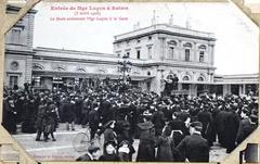 Vintage postcard of a train station platform with people and steam locomotive