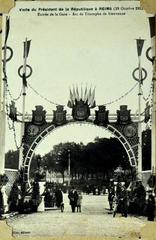 Vintage postcard album open to images of train stations and trains