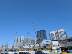 Construction site around Shinagawa area in Takanawa Gateway City with cranes and buildings under development
