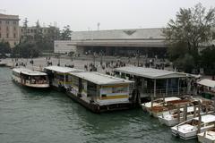 Venice Santa Lucia railway station exterior with train tracks and buildings