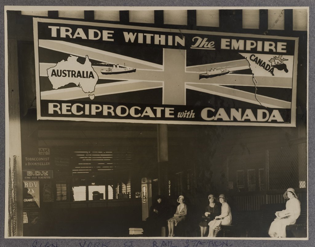 Vintage advertising billboard at Wynyard Railway Station promoting trade between Australia and Canada in 1930s
