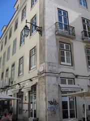 Corner of building in Baixa with main street facade and secondary street facade indicated by different stonework, Baixa, Lisbon