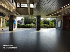 Nádraží Holešovice metro station platforms with trains and passengers