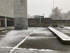Snowy day in Prague with buildings covered in snow