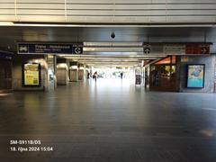 Nádraží Holešovice metro station platform with trains and passengers