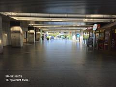 Nádraží Holešovice metro station platform with tracks and escalators