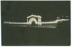 Spreckels Organ Pavilion illuminated at night with Panama-California Exposition seal