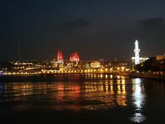 Baku cityscape at night with illuminated red towers