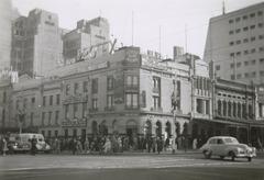Vintage black and white photo of Young & Jackson hotel interior with people and bar counter around 1950