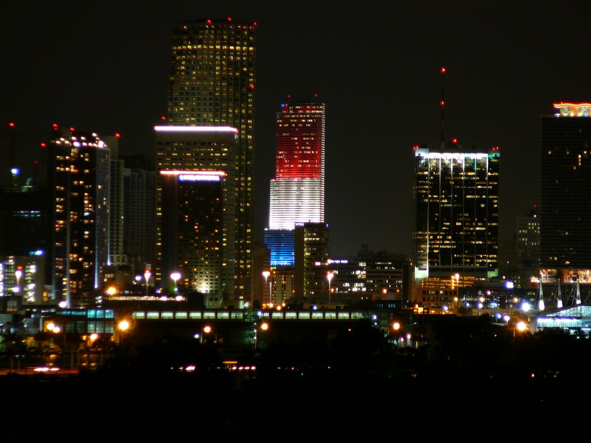 Bank of America Tower in downtown Miami lit up in red white and blue colors at night