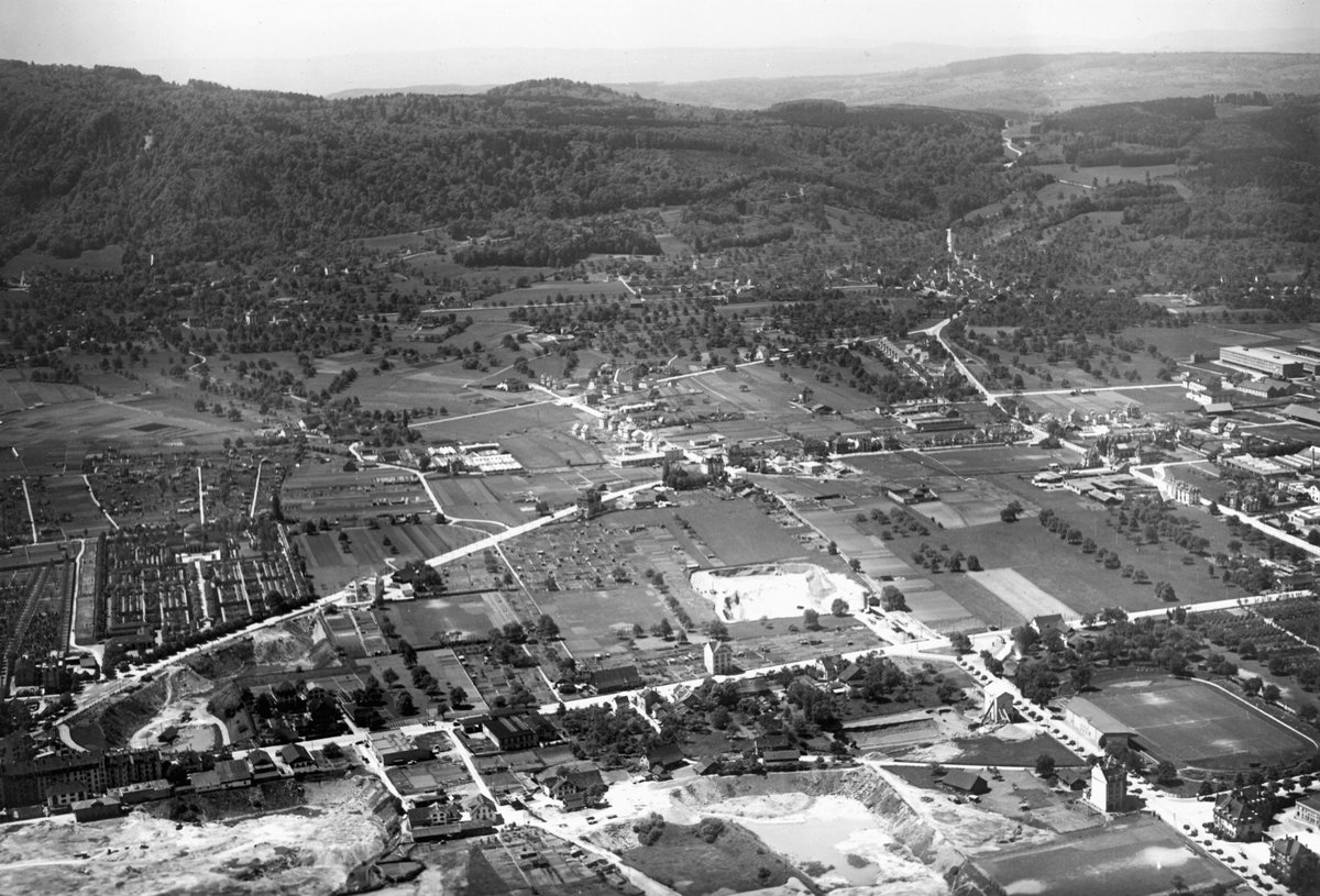 Street view of Albisrieden district with Badenerstrasse, Friedhof Sihlfeld cemetery, and Stadion Letzigrund stadium in Zurich