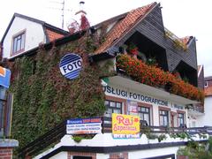 Street view of shops and service businesses in Bartoszyce, Poland