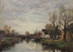 Peaceful canal scene at Voorburg in Holland showing traditional Dutch houses and boats