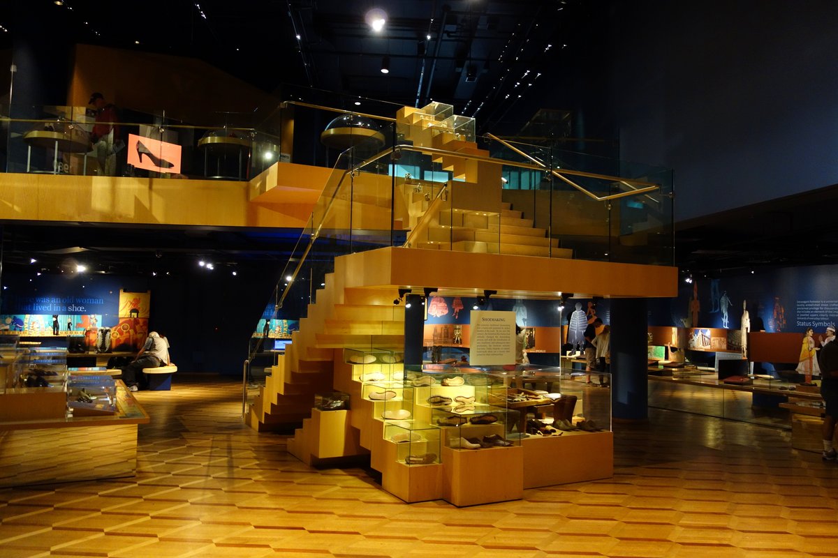 Interior view of Bata Shoe Museum showcasing diverse shoe exhibits