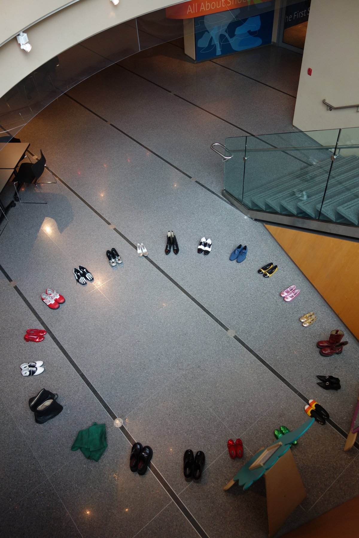 Interior view of Bata Shoe Museum with shoes displayed in a circular arrangement